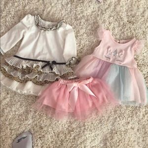 2 dresses and one tutu 6-9 months - 2 are new